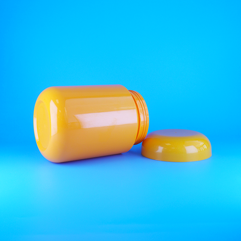 شیشه های پلاستیکی گرد نارنجی رنگ با درب پیچی برای کوکی ها و آب نبات پنبه ای، درب نارنجی